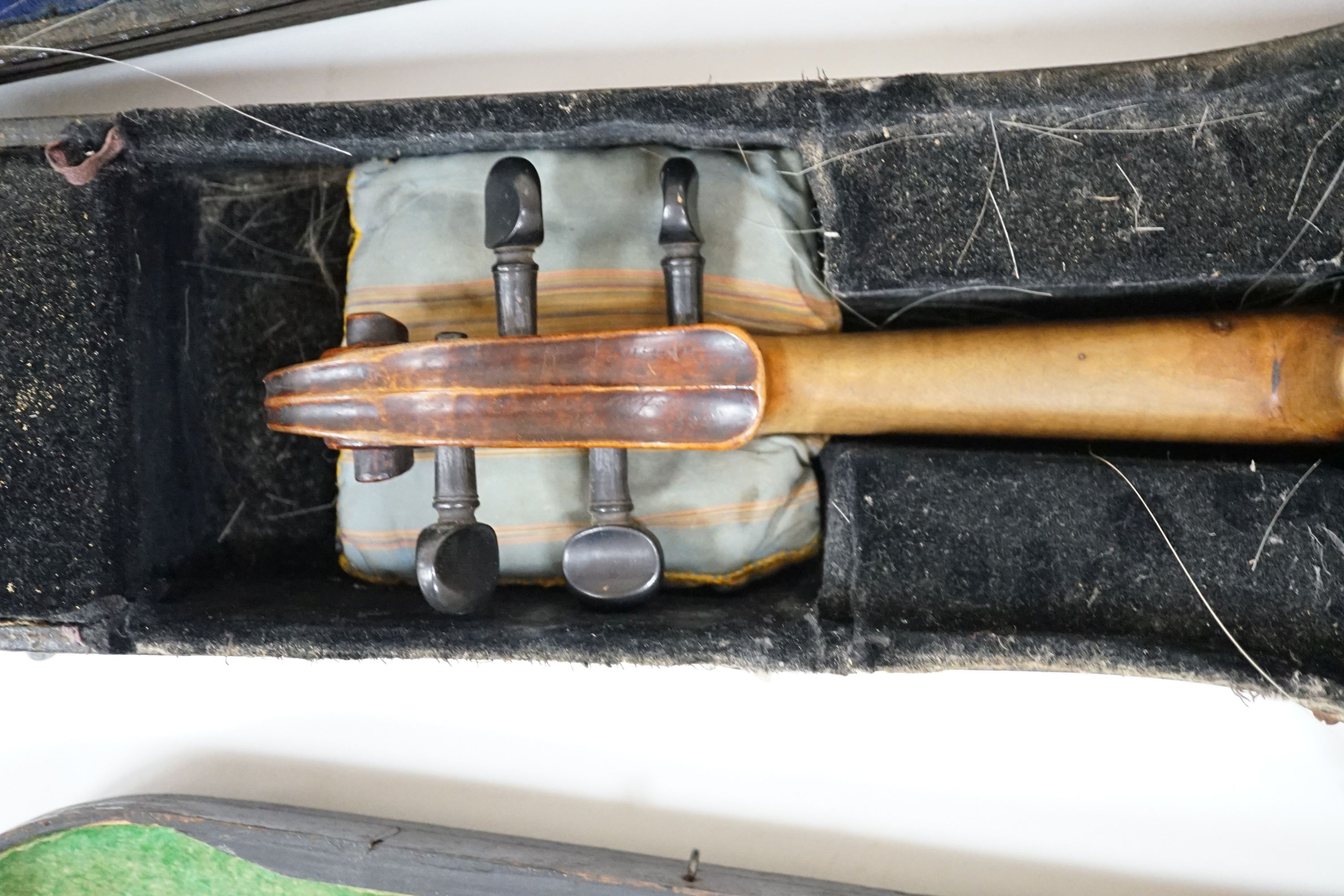 A 19th century 3/4 size violin, cased with 2 bows and 1 other German violin